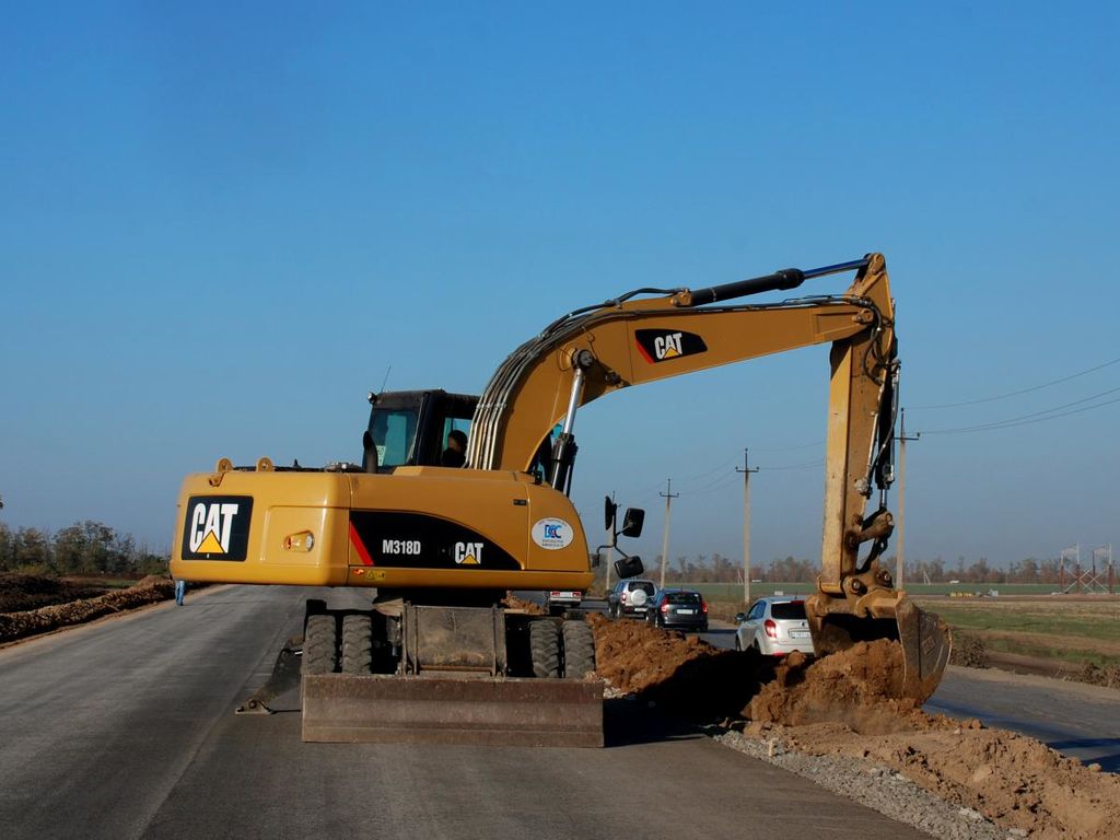 Аренда экскаватора колесного Caterpillar 318, Минская область, цена в  Минске от компании УМ-2020